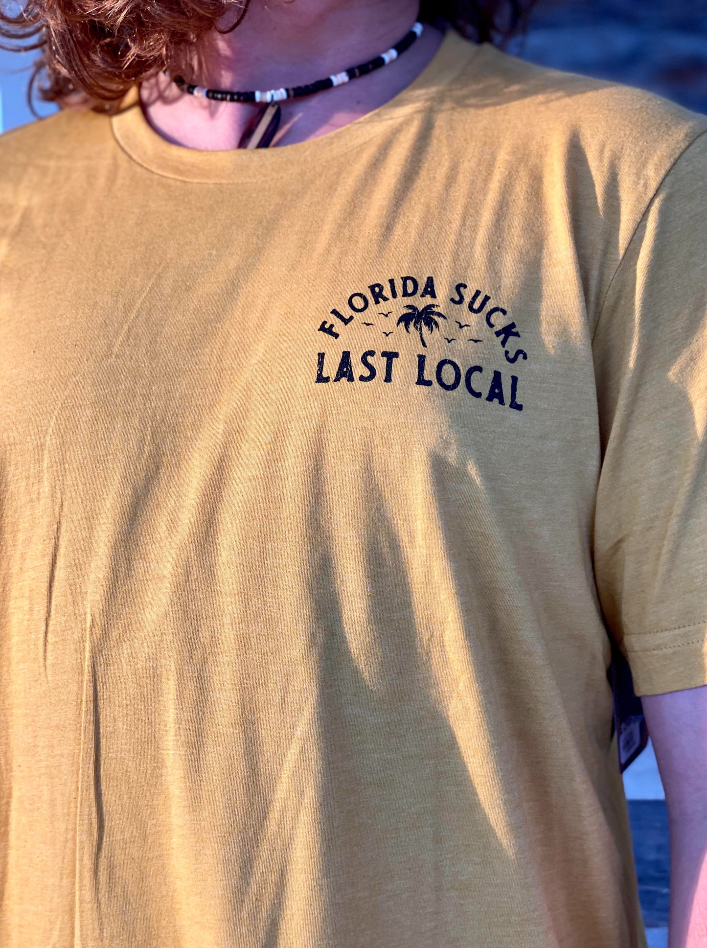 Florida Sucks Tee - Gold